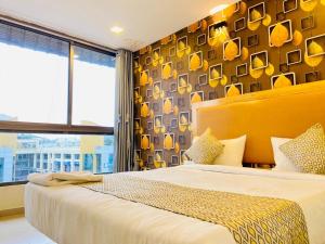Postel nebo postele na pokoji v ubytování Hotel Alexa - Satellite Prahladnagar, Ahmedabad