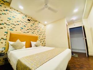 Postel nebo postele na pokoji v ubytování Hotel Alexa - Satellite Prahladnagar, Ahmedabad