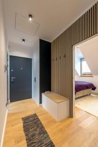 a bedroom with a bed and a closet at Wave Apartments Szentendre in Szentendre +6 photos