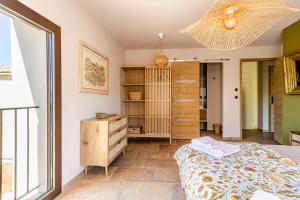 a bedroom with a bed and a closet at KM2 in Bédoin +20 photos