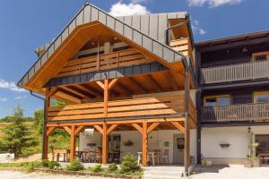 a house with a staircase on the side of it at Muraň2 in Terchová