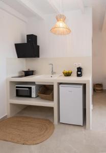 Kuchyň nebo kuchyňský kout v ubytování Kanelis Studios & Suites