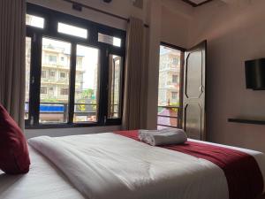 Uma cama ou camas num quarto em Hotel Nevis