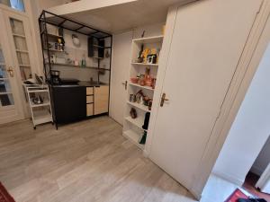 an open door to a kitchen with a counter at Cozy and nice homestay room - chambre d'hôte in Paris