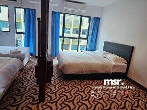 A bed or beds in a room at Kota Kinabalu City Ensuite at SCSP Ming Garden
