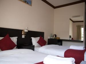 Uma cama ou camas num quarto em Hotel Nevis