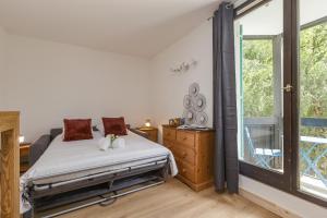 En eller flere senge i et værelse på Chamonix Sud - Balme 102 - Happy Rentals