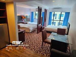 A bed or beds in a room at Kota Kinabalu City Ensuite at SCSP Ming Garden