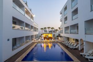 an image of the courtyard of a building with a swimming pool at Milea Hotel in Ayia Napa