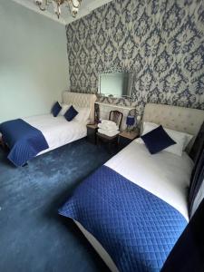 Postelja oz. postelje v sobi nastanitve Bray Head B&B