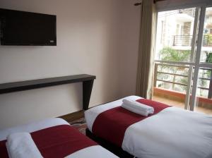 Uma cama ou camas num quarto em Hotel Nevis