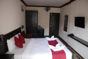 Uma cama ou camas num quarto em Hotel Nevis