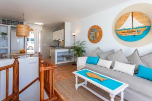 a living room with a couch and a table at Eslanzarote Varadero House, super wifi in Tías