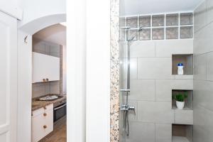 a bathroom with a shower and a sink at Eslanzarote Varadero House, super wifi in Tías +76 photos