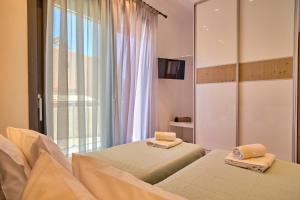 Кровать или кровати в номере Christos Corfu Premium Suites