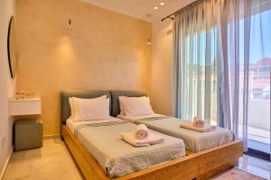 Кровать или кровати в номере Christos Corfu Premium Suites
