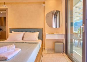 Кровать или кровати в номере Christos Corfu Premium Suites