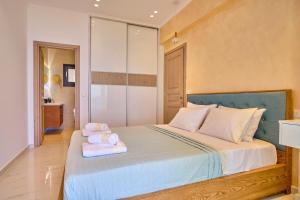 Кровать или кровати в номере Christos Corfu Premium Suites