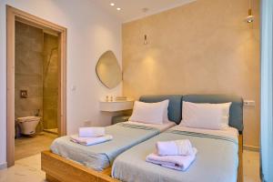Кровать или кровати в номере Christos Corfu Premium Suites