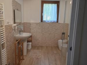 a bathroom with a sink and a toilet at Dalla Gina e Paolino B&B in Aulla +29 photos
