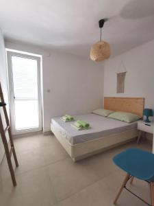 Postel nebo postele na pokoji v ubytování Apartments Silver