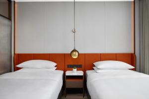 Letto o letti in una camera di Home2 Suite by Hilton Shenzhen Bao'an