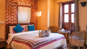 Letto o letti in una camera di Hong Si Hotel- A Home Away from Home
