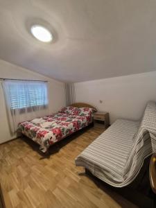 Postel nebo postele na pokoji v ubytování Apartman KOLAREK