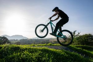 a person doing a trick on a bike in the air at MTB Jumps View Pod in Trawsfynydd