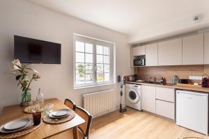Kuchyň nebo kuchyňský kout v ubytování Le Clos Émeraude - Appt de 30 m² à Dinard