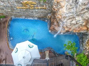 an overhead view of a swimming pool with an umbrella at Green LP Hotel & Apartment in Vung Tau