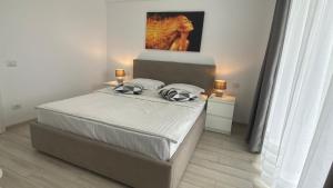 Ένα ή περισσότερα κρεβάτια σε δωμάτιο στο Apartament Ovy Residence Râșnov