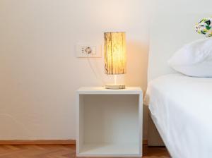 Postel nebo postele na pokoji v ubytování Laganini apartman Rab