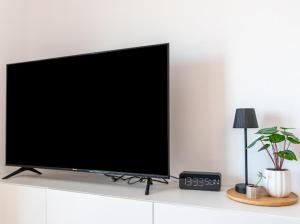 TV a/nebo společenská místnost v ubytování Laganini apartman Rab