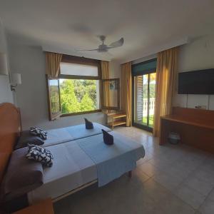 Posteľ alebo postele v izbe v ubytovaní Hotel Bonsol