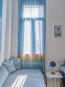 A bed or beds in a room at Shades of Blue