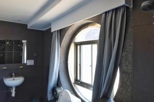 Koupelna v ubytování Love River Inn 愛河日央 + 37 fotografií
