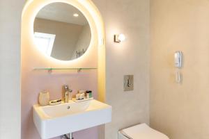 a bathroom with a sink and a mirror at St. George Hotel in Sofia +48 photos