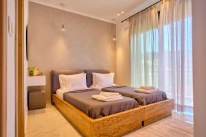 Кровать или кровати в номере Christos Corfu Premium Suites