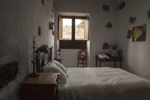 Tempat tidur dalam kamar di Villa Rural Gloria´s