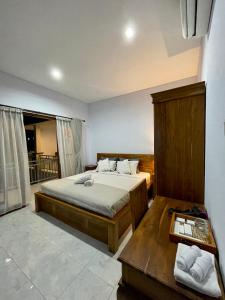 Postel nebo postele na pokoji v ubytování Chua Guest house Canggu