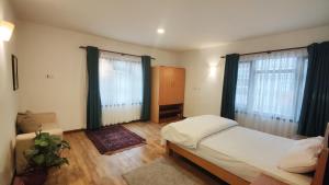Letto o letti in una camera di Nextdoor Kathmandu
