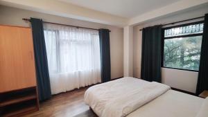 Letto o letti in una camera di Nextdoor Kathmandu