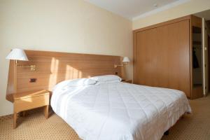 Postel nebo postele na pokoji v ubytování Hotel San Pancrazio