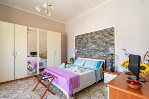 Ένα ή περισσότερα κρεβάτια σε δωμάτιο στο Casa Aurora Luxury Apartment +28 φωτογραφίες