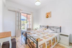 Postel nebo postele na pokoji v ubytování Kassiopi Apartment 1
