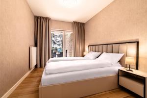 Postel nebo postele na pokoji v ubytování Nautica Resort
