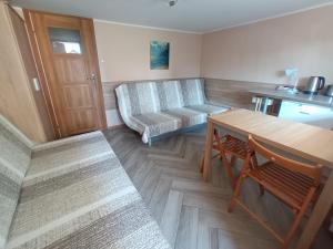 Posezení v ubytování Apartamenty i pokoje u Kryni