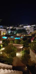 an aerial view of a park at night at Pleiades Modern Villa with Shared Pool in Ornos in Ornos