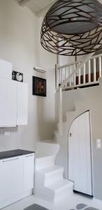 a room with a staircase and a white stair case at Pleiades Modern Villa with Shared Pool in Ornos in Ornos